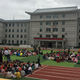Students sit on a playground of a school in Yanji, Jilin province, China as they are evacuated after a seismic event in North Korea, Sept. 9, 2016.